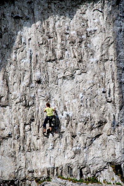 Rock climber at Malham Cove. Pennine Way, Yorkshire Dales