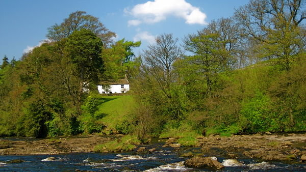 Idylic cottage on the banks of the River Tees. Pennine Way, Yorkshire
