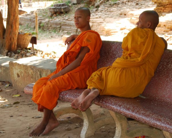 Monks relax in noon-day sun