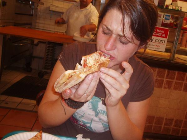 Kim devouring pizza