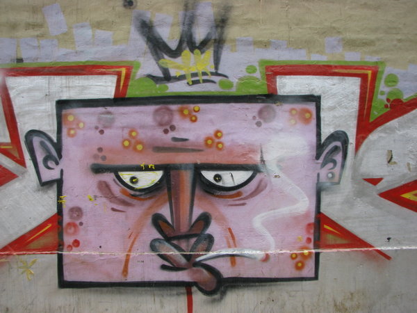 Mural of Weird Square Head Guy with a J