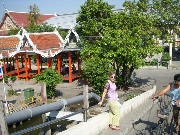 Crossing the Bridge. There was a decorative Buddhist Temple across the river.