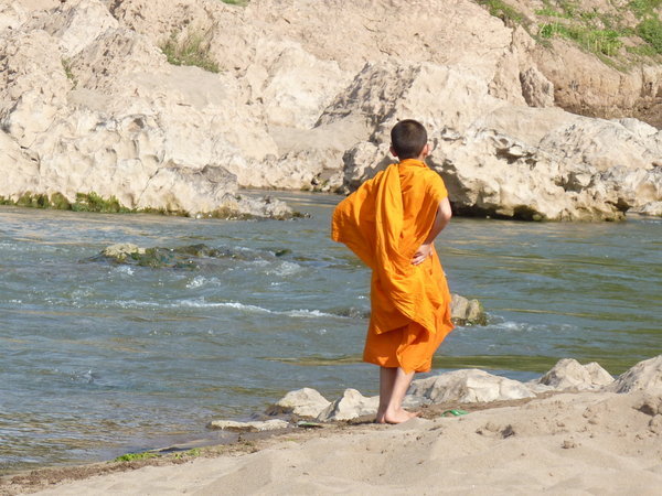 Young Monk at water's edge