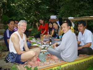 Steve having a great lunch with a Lao Family at one of the waterfalls.