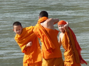 Young Monks Wrestling by the Mekong