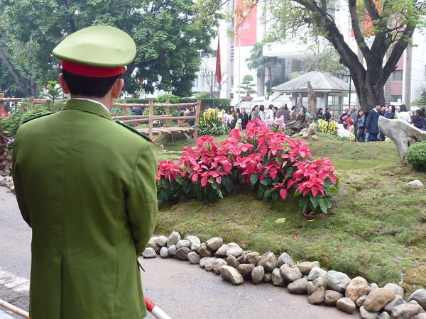Police standing guard of the flower display