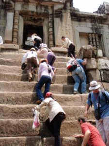 People climbing the steep steps