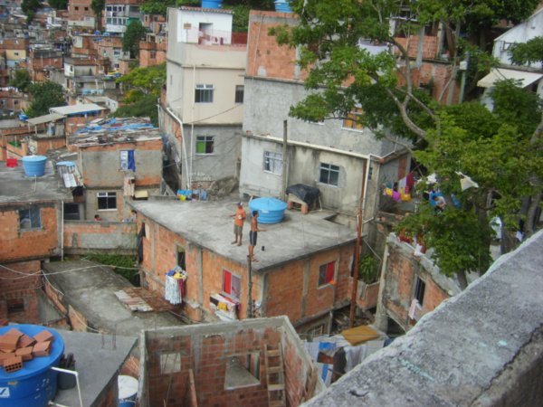 Cramped conditions and workers in the favela