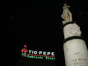 statue and neon sign