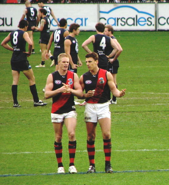 mcphee and lloyd (team captain) having a chat