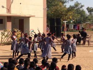 young girls dancing wearing their school uniform