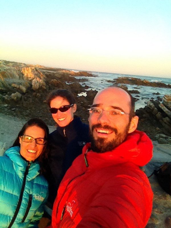 3 happy cyclists at Cape Agulhas