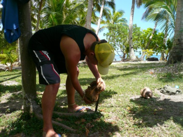 Husking a coconut