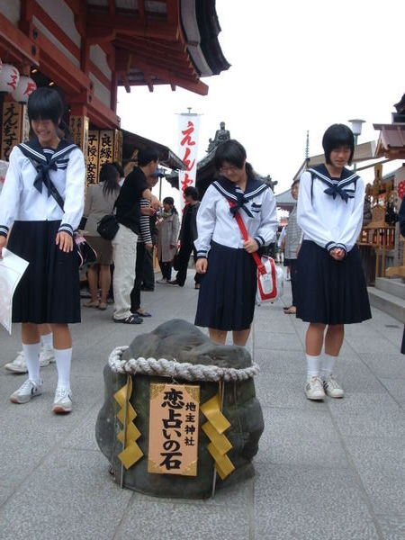 schoolgirls navigating the stumbling stones