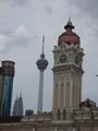 The old clock tower in Merdeka Square and the KL Tower