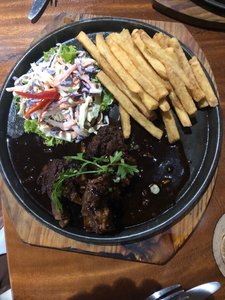 Sticky ribs with coleslaw and chips