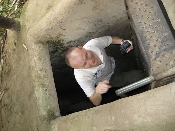 Climbing out of the Cu Chi Tunnels
