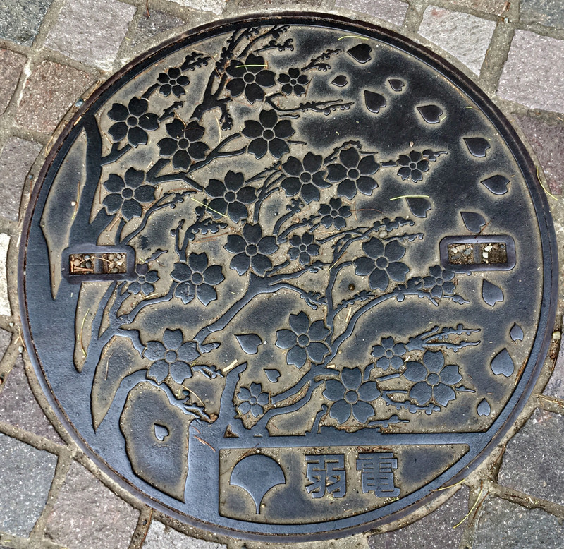 Blossom manhole cover. 