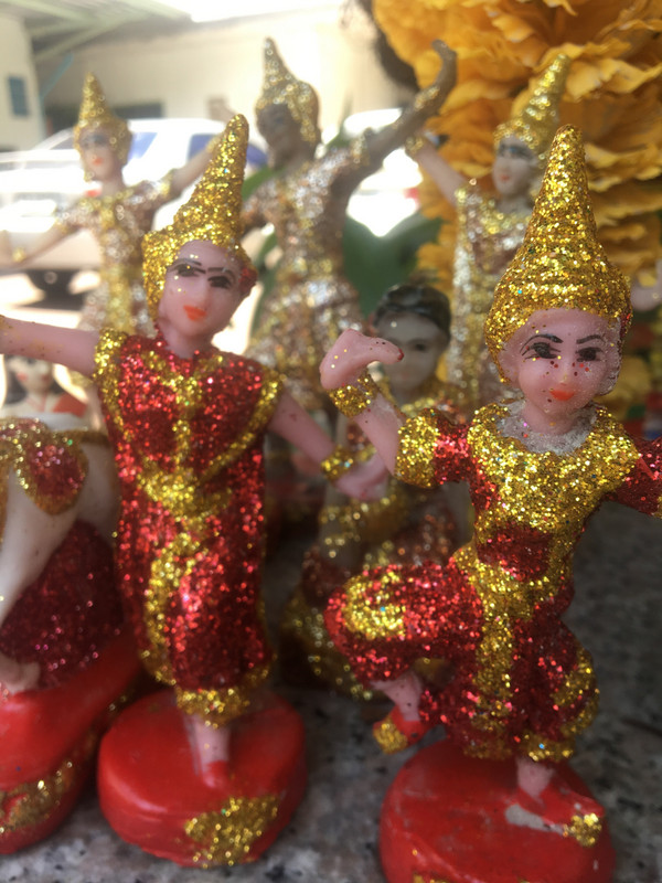 thai dancer figurines in the spirit house