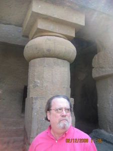 Mike in front of a column
