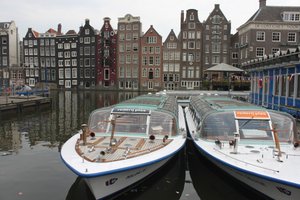 Boats on canal cruise tours in Amsterdam
