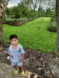 Bao (5 years old) in his village - Can Tho, the Mekong Delta