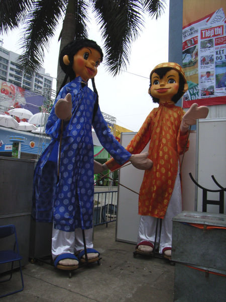 The puppets wear Vietnamese traditional dress