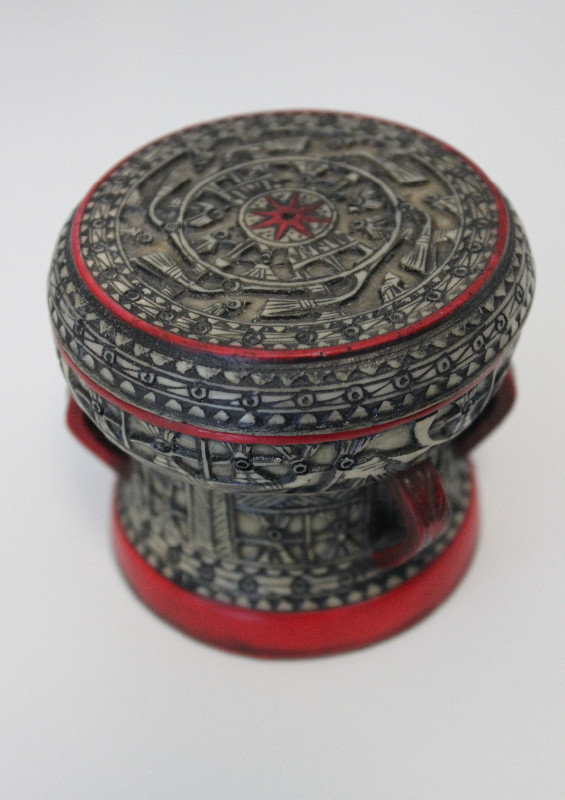 Stone drum with traditional carving