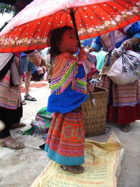 Little H'mong girl with umbrella
