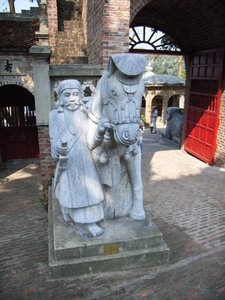 Statues at the gate into the palace