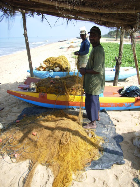 Two fishermen at Negombo beach