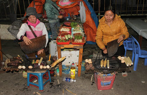Grilling food for sale at night in Sapa town