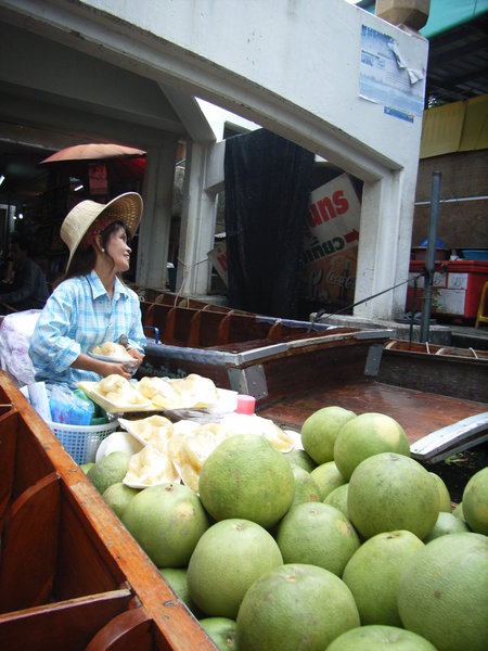 A Thai lady selling grapefruits and durian