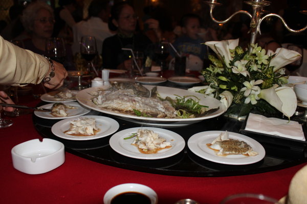 Fish is shared to 10 plates for guests