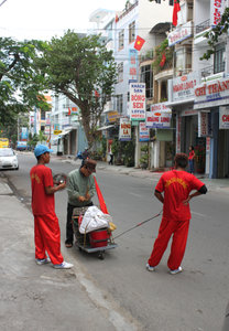 Beating drum on a street in Nha Trang