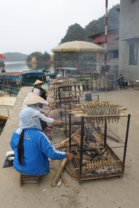 Baking fishes outside a temple