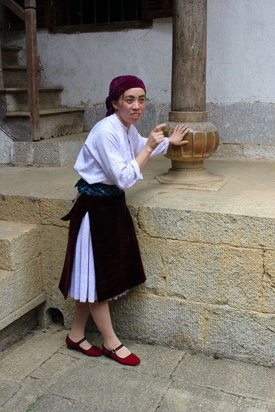 A white H'mong girl in traditional dress