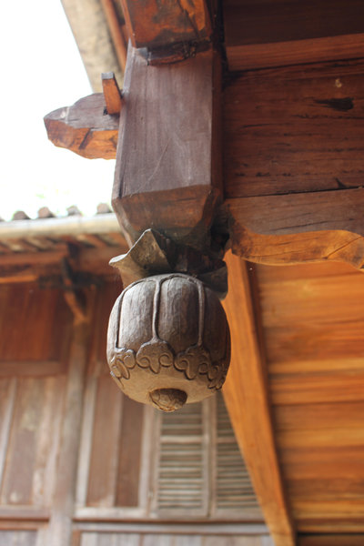 A wood carved opium symbol at Hmong King's castle