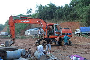 Excavator at workers base camp