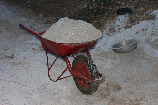 A trolly for carrying white sand