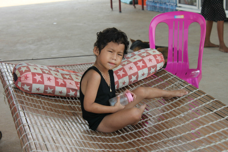 A Cambodian child at the gasoline station