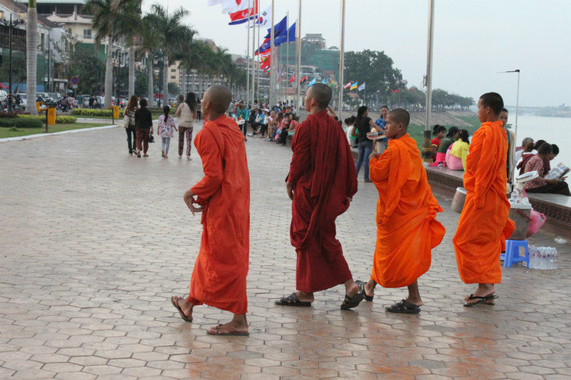 Monks by the Mekong river