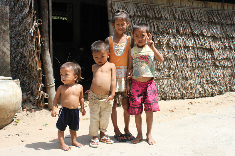Khmer children outside their house in a village