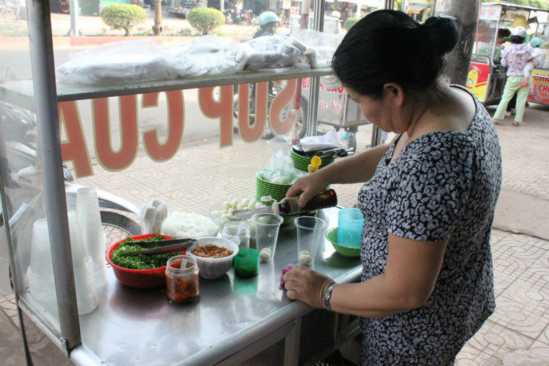 Making crab soup at a street side restaurant