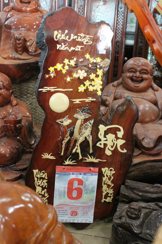 Wood painting calendar in Đồng Xoài town