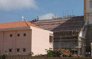 Working on the roof-top of the church