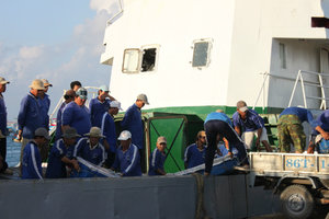 Porters carried goods onto the ship