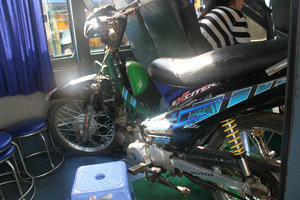 A motorbike inside a bus from Bình Châu to Sài Gòn