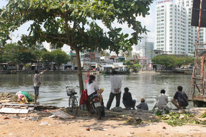 Catching fish next to Bến Tẻ canal