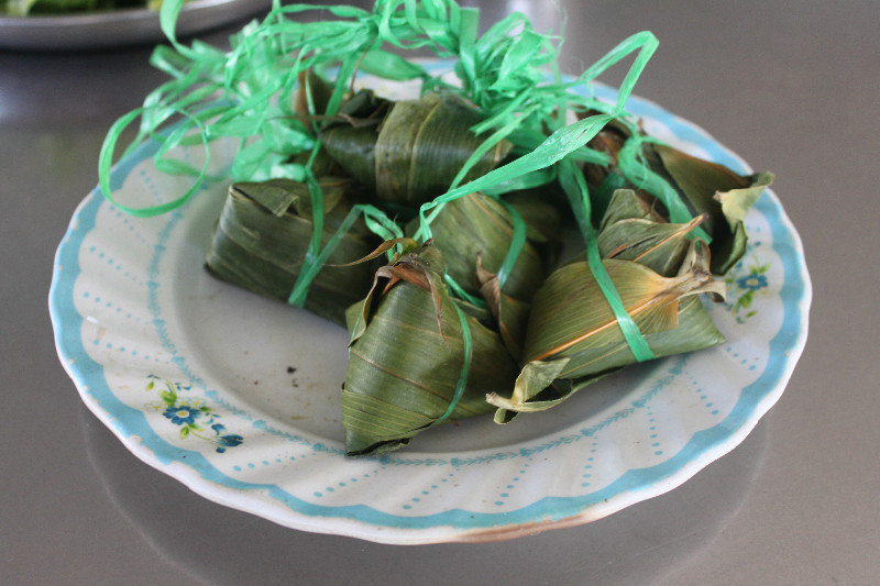 A local cake covered by bamboo leaves